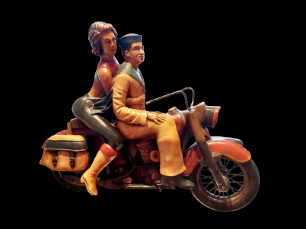 Vintage Past times sailor riding Harley Davidson