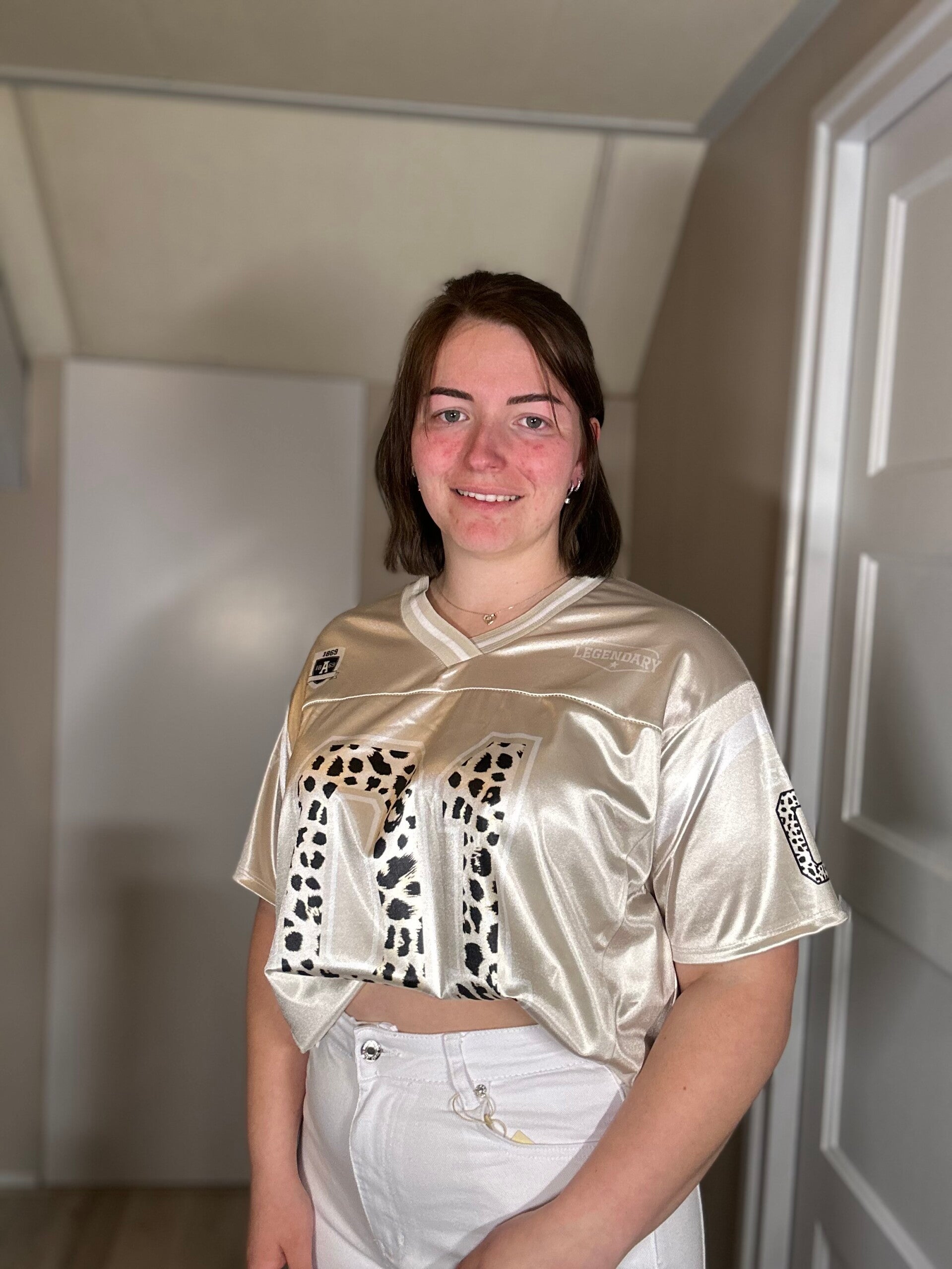 Gouden sportieve top met panterdetail