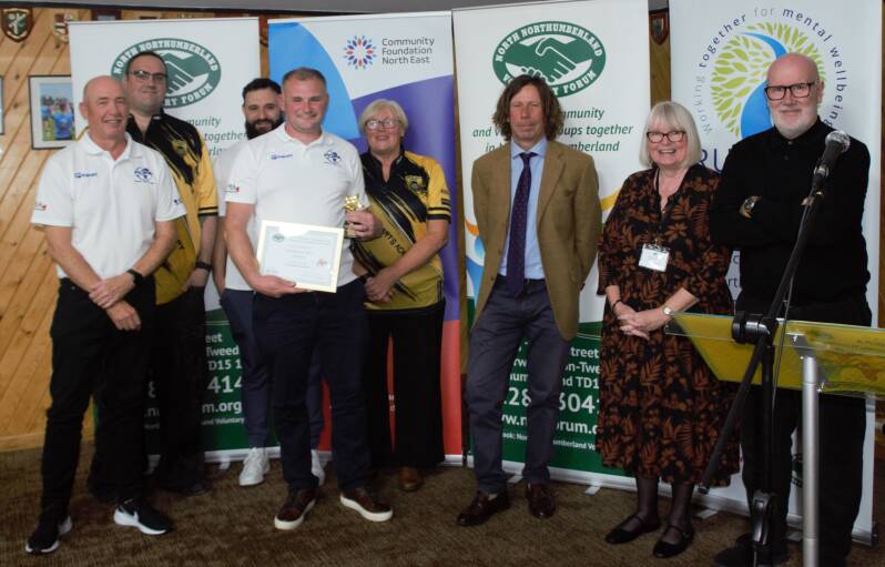 •	Grassroots Winner - Berwick Darts Academy featured with Kevin Bolton and Gary Greenaway (Andy's Man Club) and Jan Casson (Vice-Chair of the NNVF)