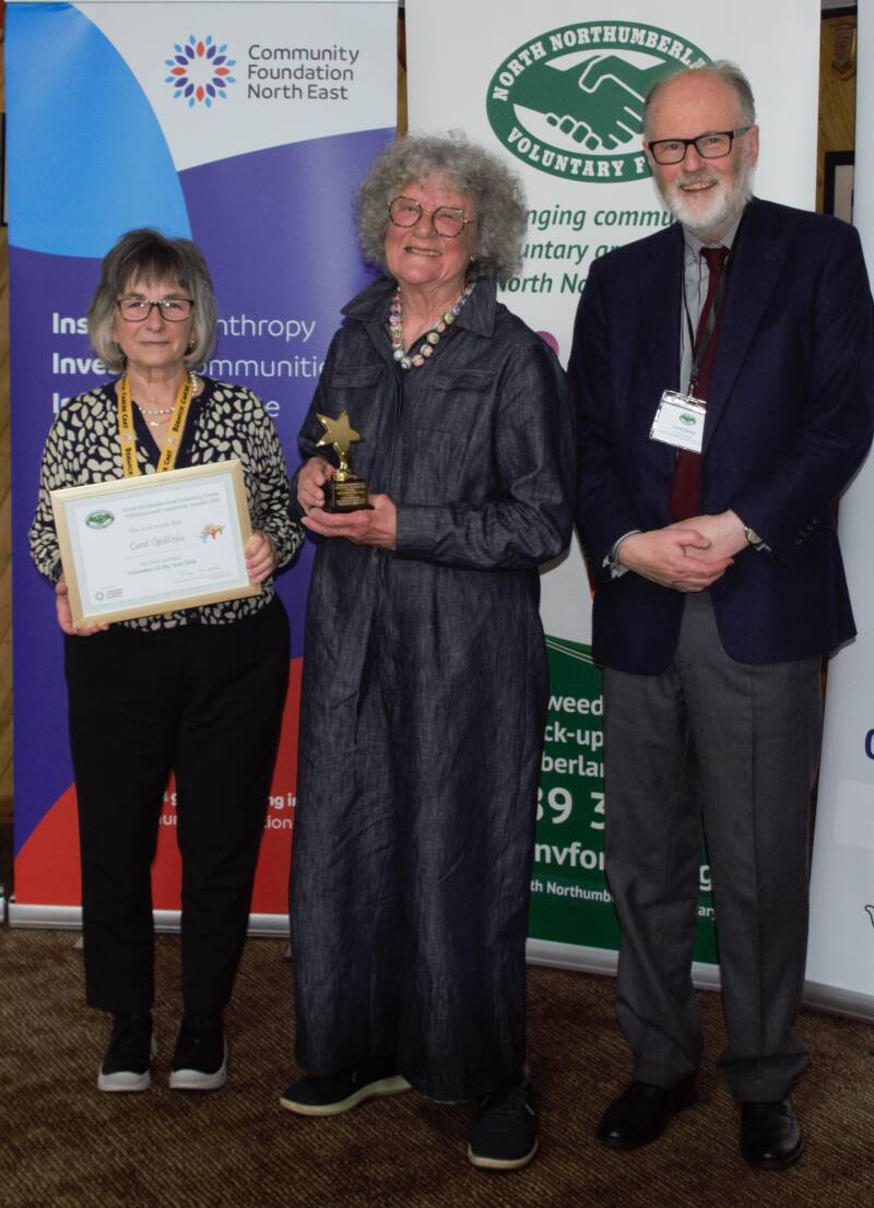 •	Volunteer of the Year Winner - Carol Griffiths (centre) with Ann Short (Cancer Cars) and Lord Joicey (President of the NNVF)