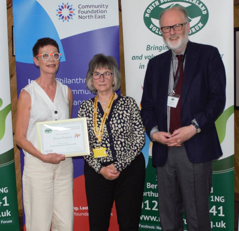 •	Volunteer of the Year Runner-up - Rowena Redgewell - Julie Fairbain accepting her certificate in Rowena's absence with Ann Short (Cancer Cars) and Lord Joicey (President of the NNVF)