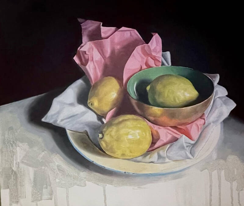 Three lemons with pink paper