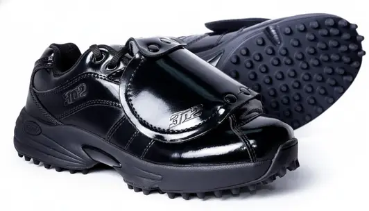 3N2 Men's Umpire Shoe Reaction Pro Plate Lo in patent leather black showing reinforced toe box and plate-specific outsole construction on a neutral background.