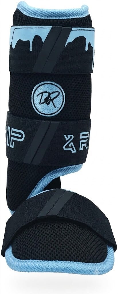 Drip & Rip baseball leg guard for baseball and softball in black with light blue drip accents and adjustable straps.
