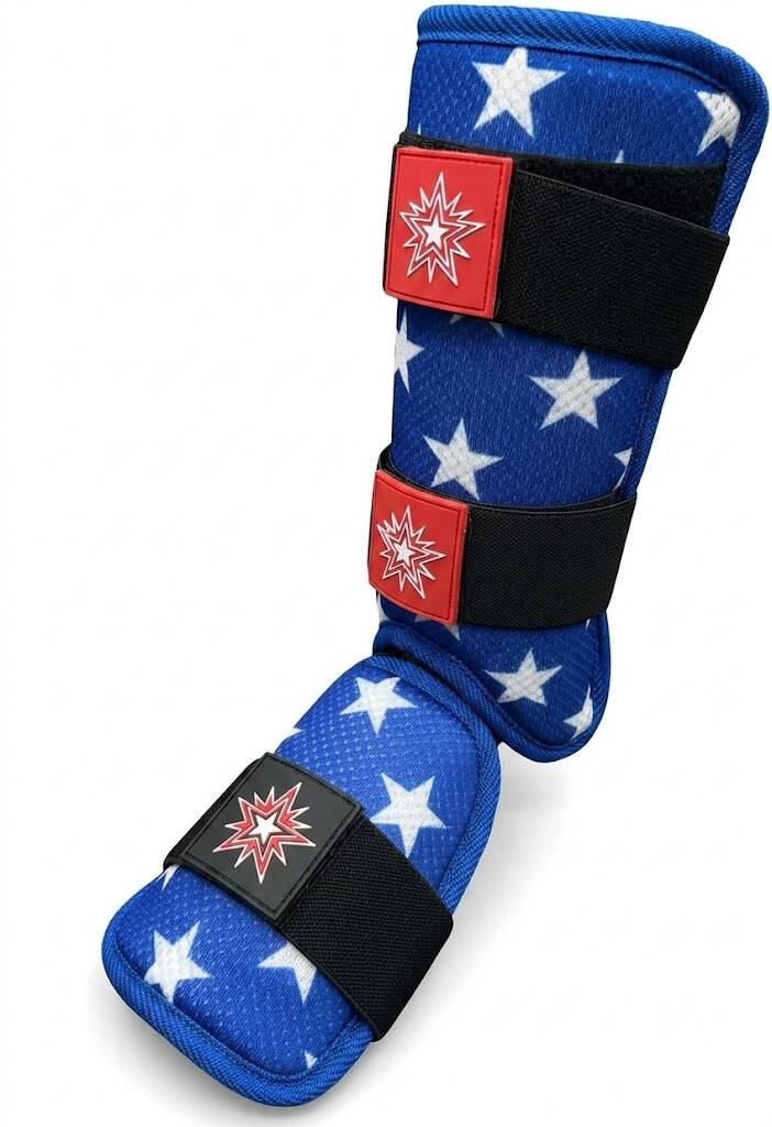 A blue baseball leg guard featuring a white star pattern and adjustable black straps on a white background.