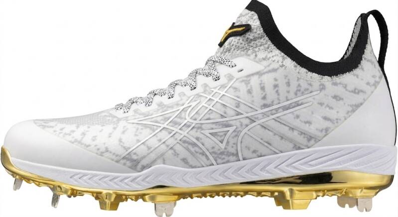 Low-cut metal spike baseball cleat with knit upper construction delivering lightweight breathability and maximum dirt and grass traction.