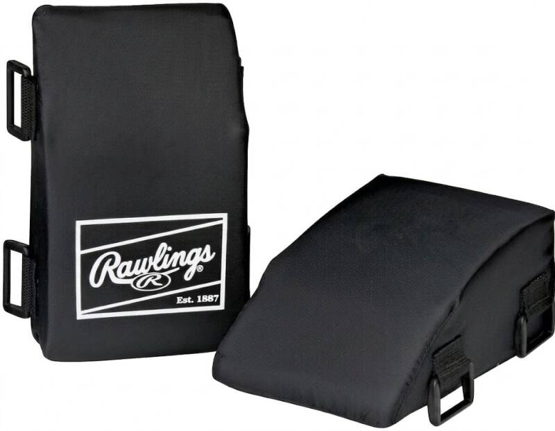 Leg guard pair in black, wedge-shaped with script branding, on a white background.