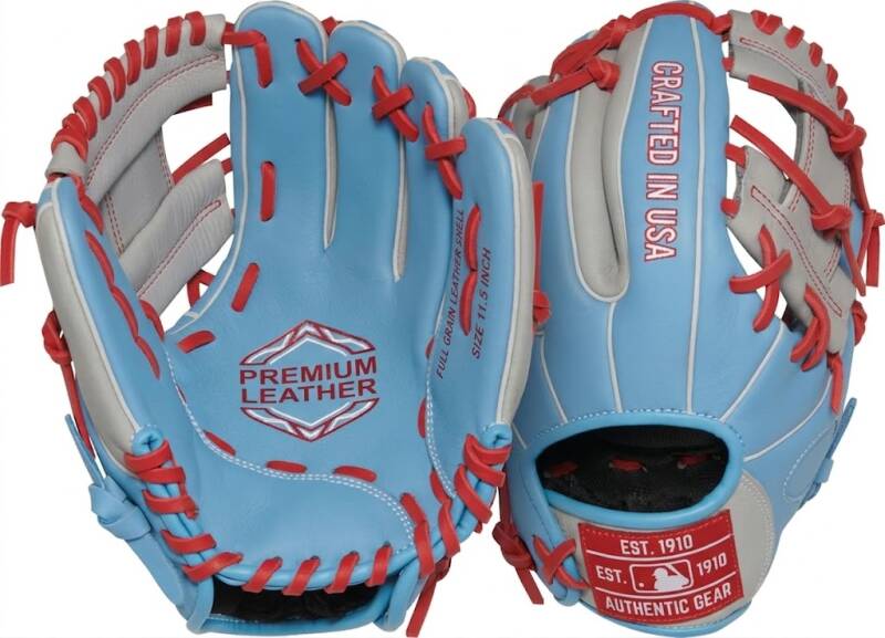 A light blue baseball glove with white piping and red lacing, featuring a "PREMIUM LEATHER" logo in the palm and "CRAFTED IN USA" on the finger.