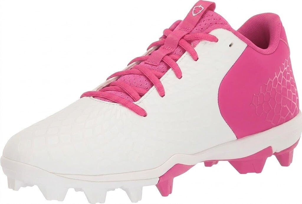 A white and pink Under Armour baseball cleat with a textured toe and pink molded spikes on a white background.