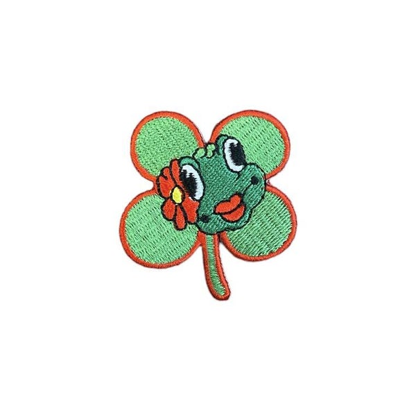 Klavertje 4 kikker met bloem