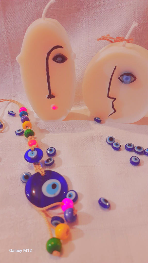 2 bougies moulées visage