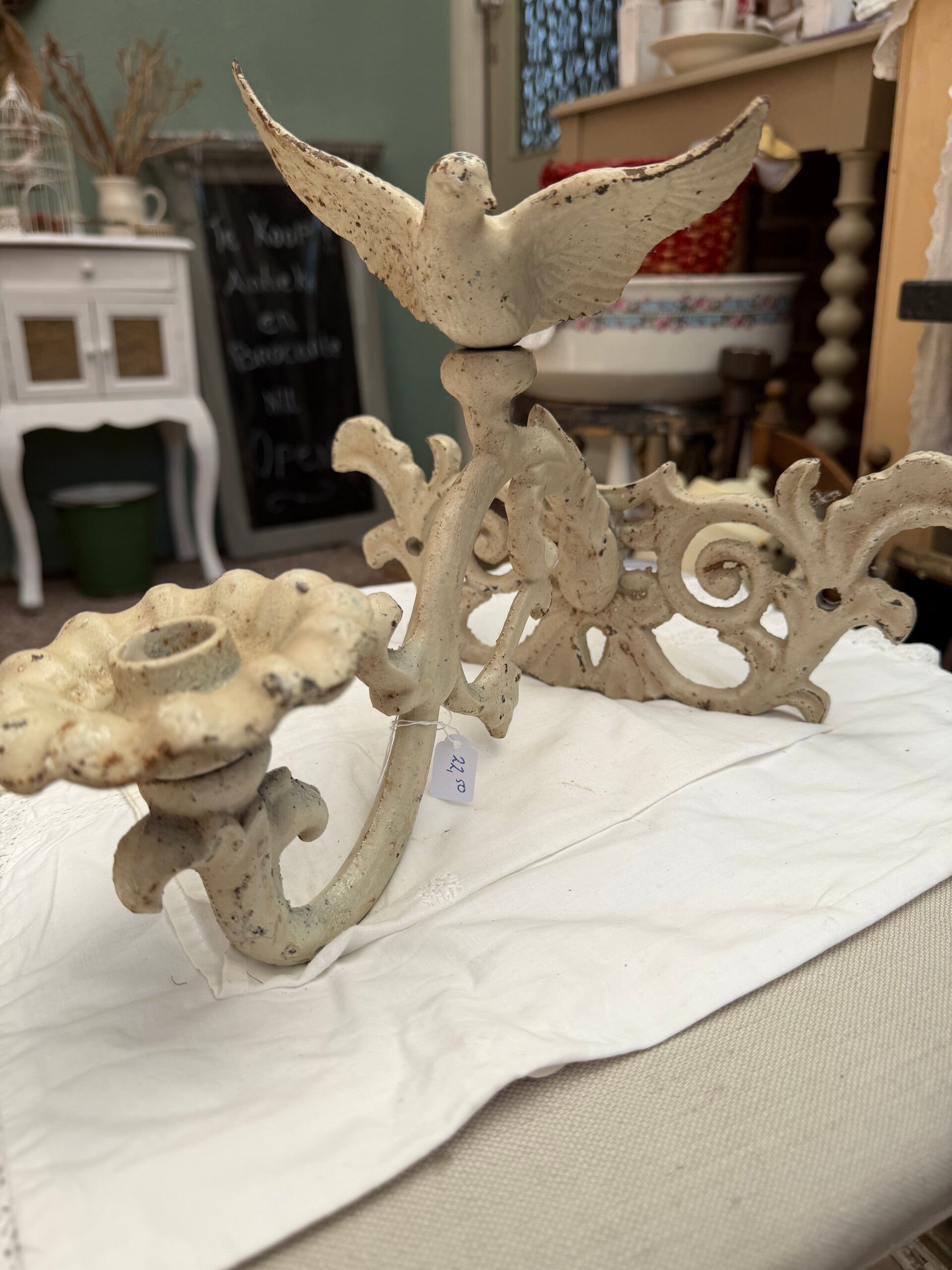 Wandhanger voor een kaars van gietijzer