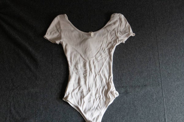 body met rits en korte mouw