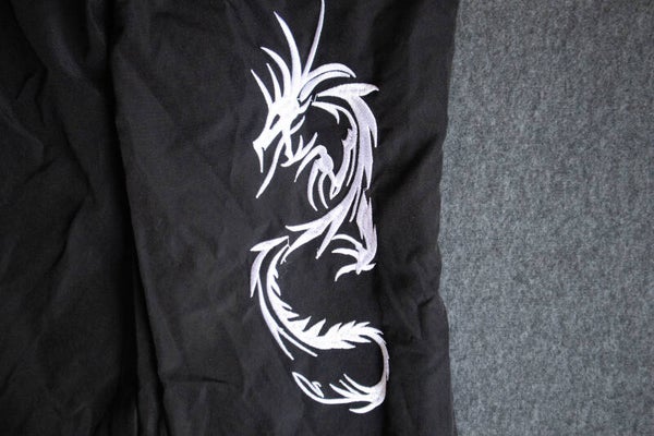 lange zwarte broek met draak