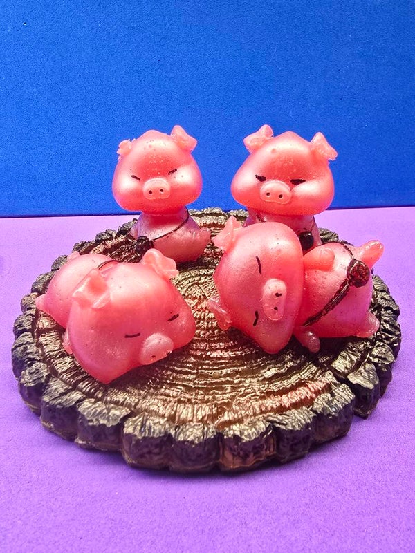 4  Little Piggies Resting on a Stump