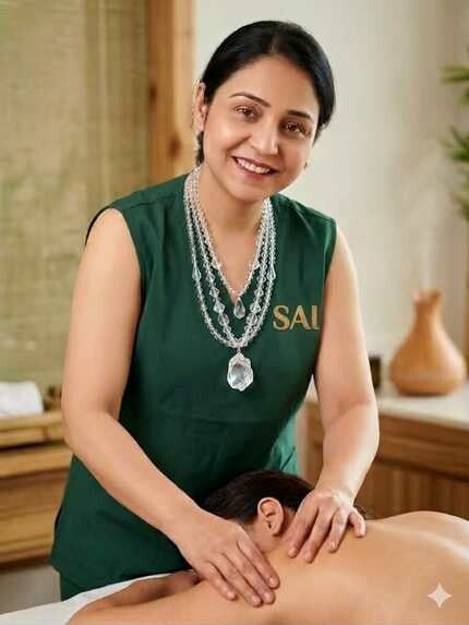Chandni giving a massage treatment at SAI Massage and Wellness in Calgary