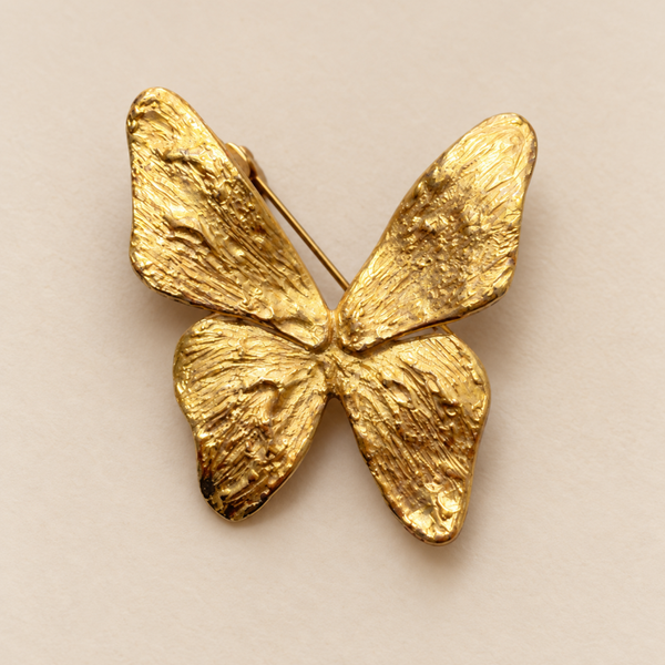 Broche papillon doré-marquée Yves Saint-Laurent