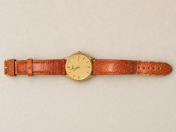 Montre Seiko Quartz dorée avec date et bracelet brun