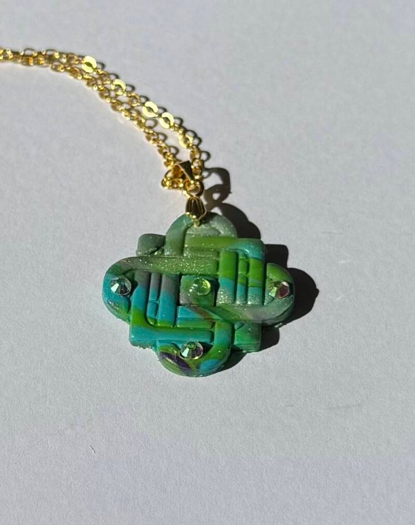 Embossed knot style pendant