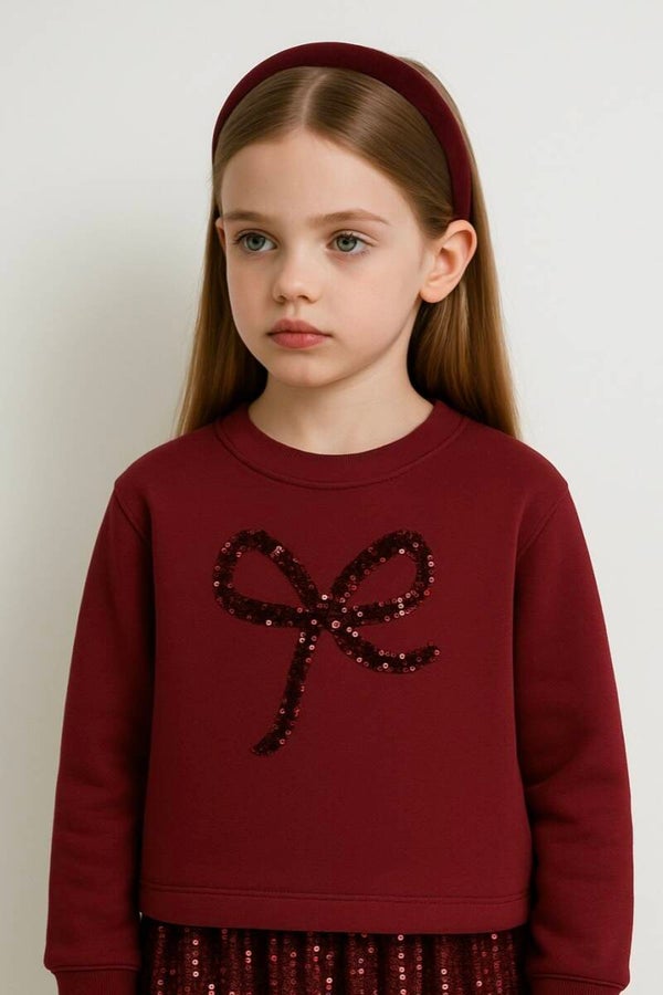 Trui met glitter strik