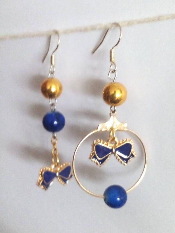 Boucles d'oreilles nœuds chic bleu et or