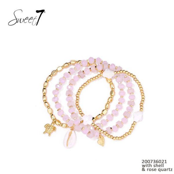 Set van armbanden roze