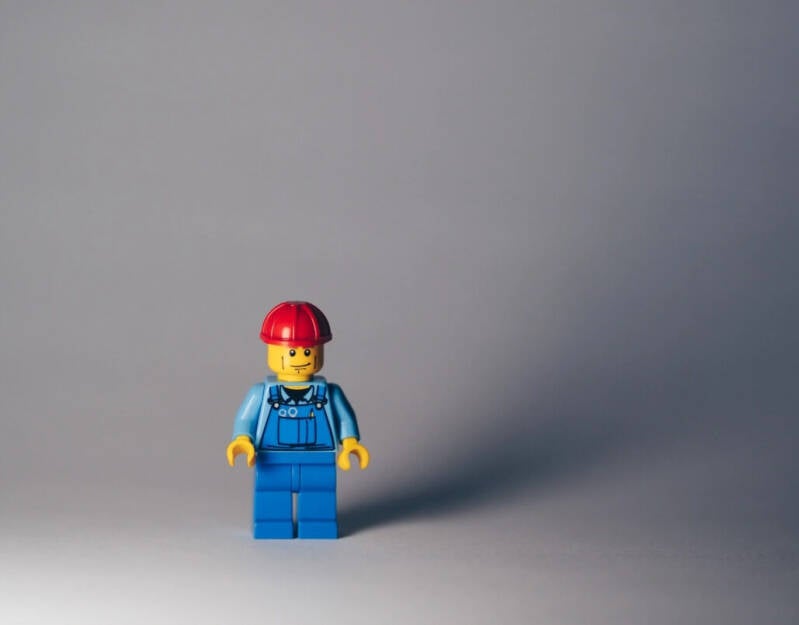 Skilled tradesperson working on a home project, showcasing the value of professional services for quality and efficiency.