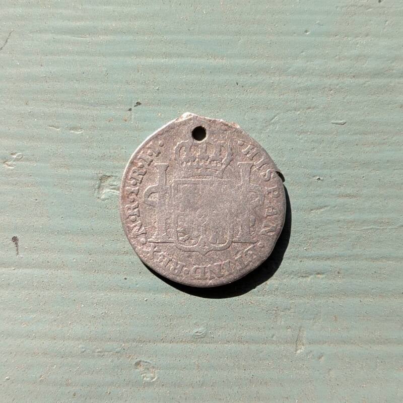 Reverse of 1799 Spanish 1 Reale coin minted for the King of Spain, found at the 1832 Bryan House