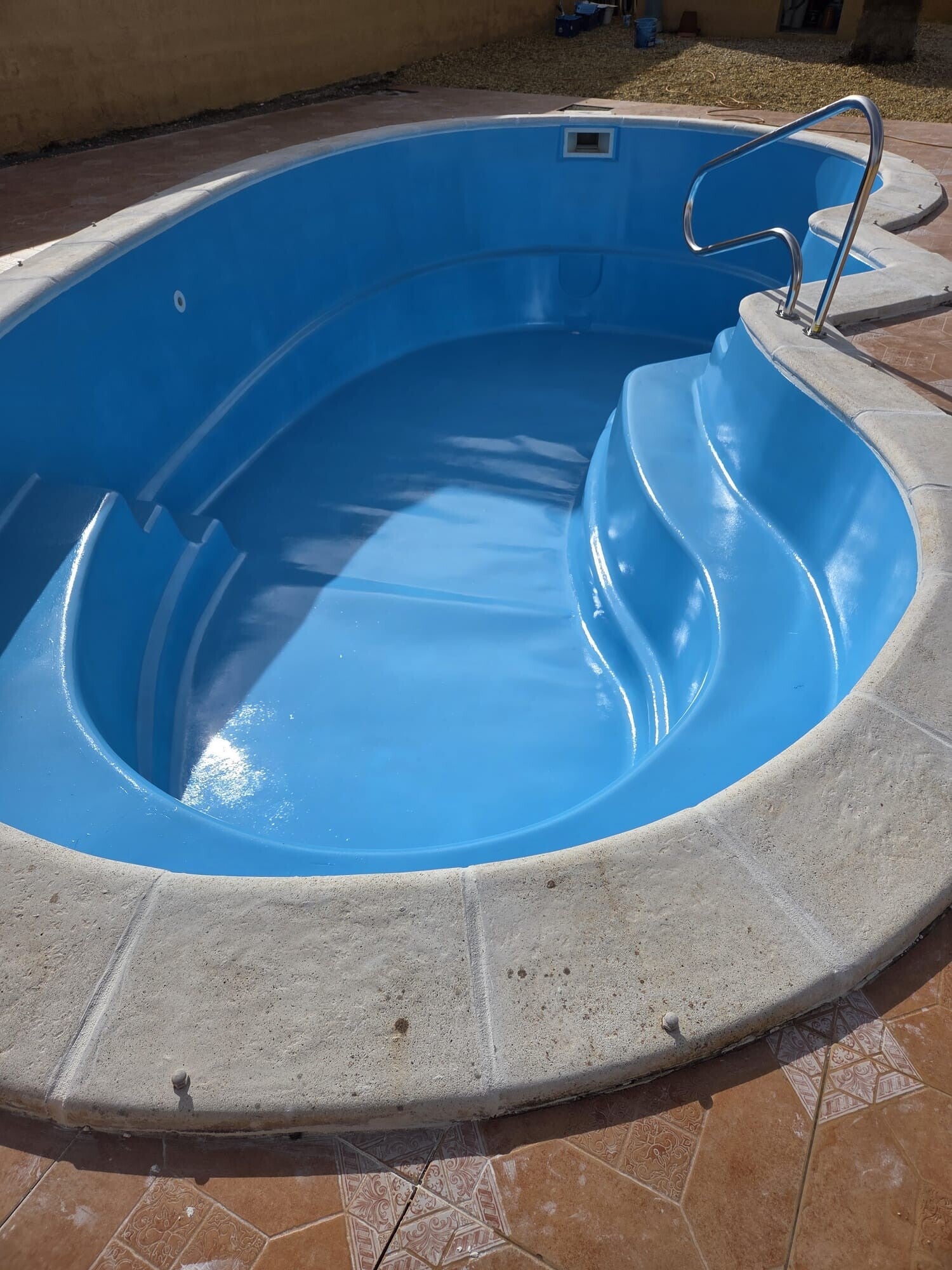 Replace swimming pool surround coping stones.
