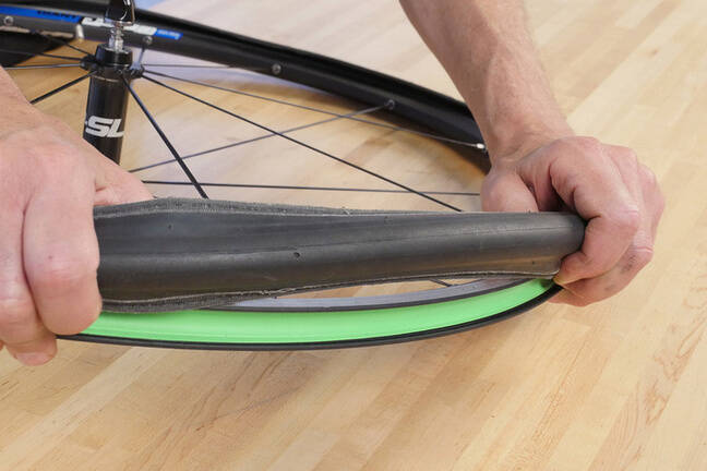 Oban Cycles fitting tyres and tubes