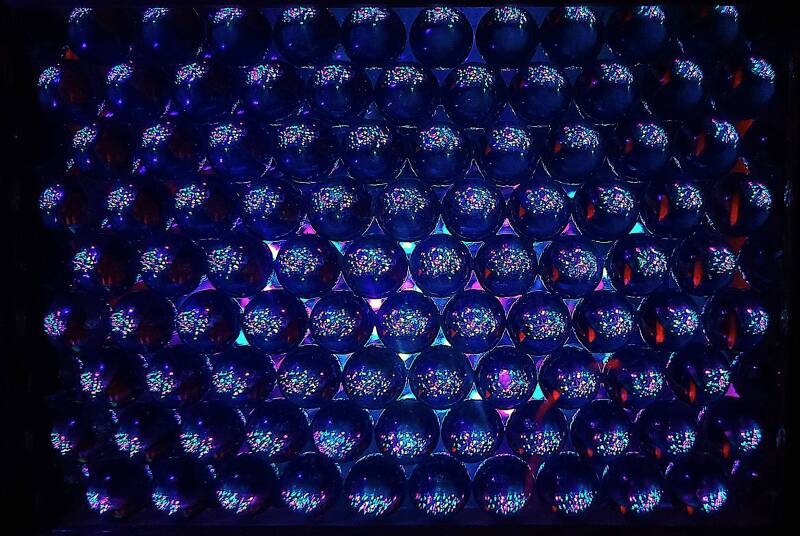 Offset marble matrix screen and LEDs shows analog pixel sized color morphing starlike points of light with some smaller than many single celled organisms.