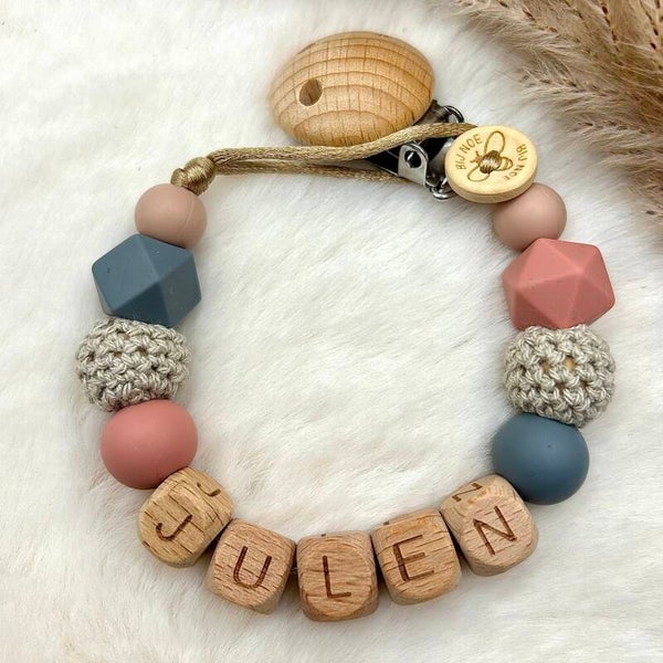 Speenkoord met naam “Warm Julen”