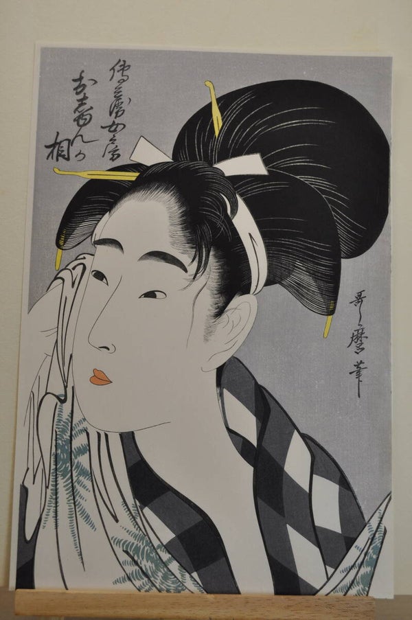 Woman wiping off sweat