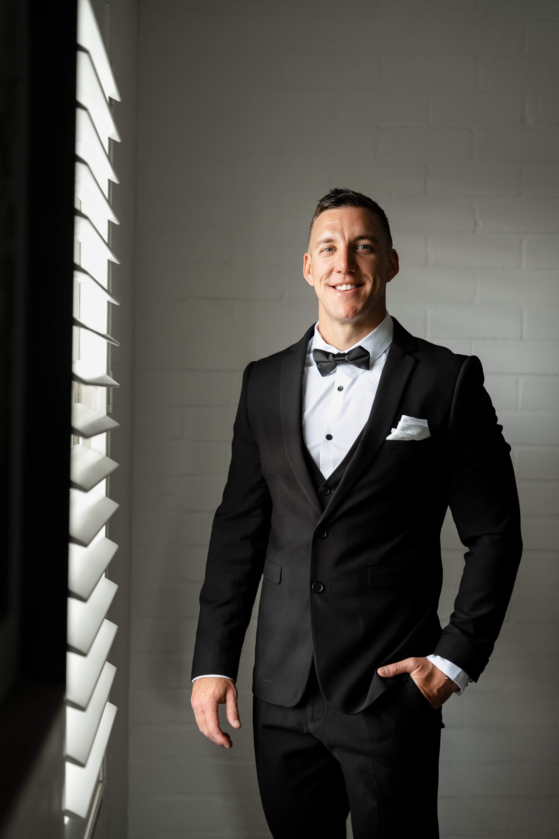 Sydney wedding celebrant and MC Riley Farlow in black tuxedo before wedding ceremony