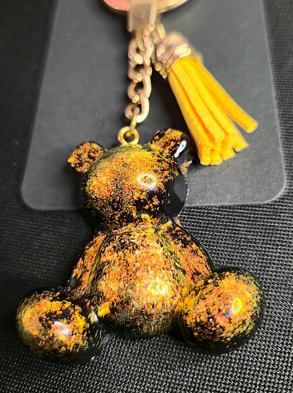 Ourson noir à reflets jaune/orange