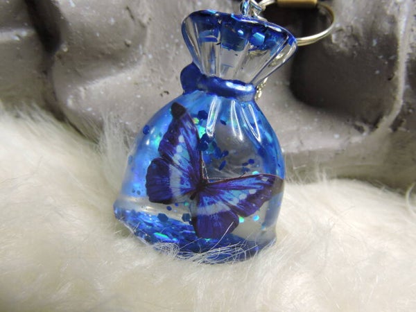 porte clé sac bleu+ papillon