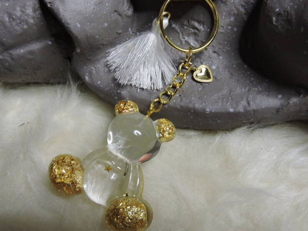 porte clés ourson transparent avec feuilles d'or