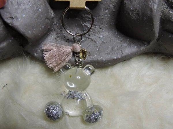 porte clés ourson transparent avec feuilles argentées