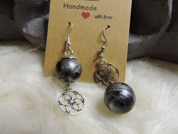 boucles d'oreilles assymétriques