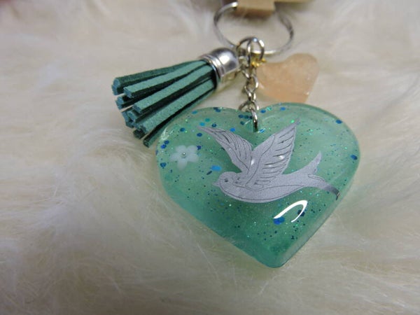 porte clés coeur vert avec hirondelle