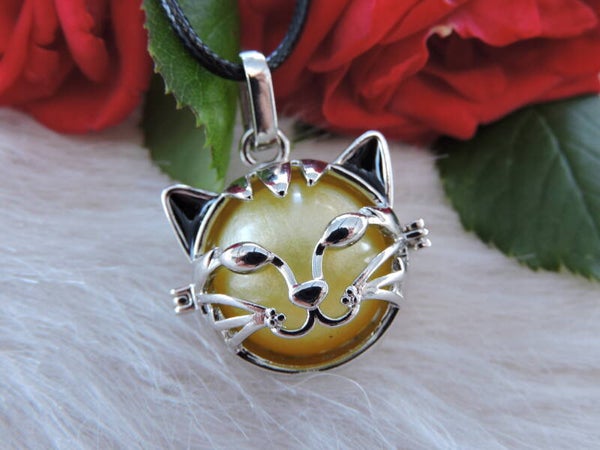 pendentif cage  tête de chat en acier inoxydable + boule résine jaune