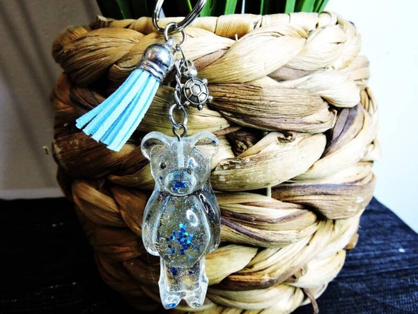 porte clés ourson transparent à paillètes bleues