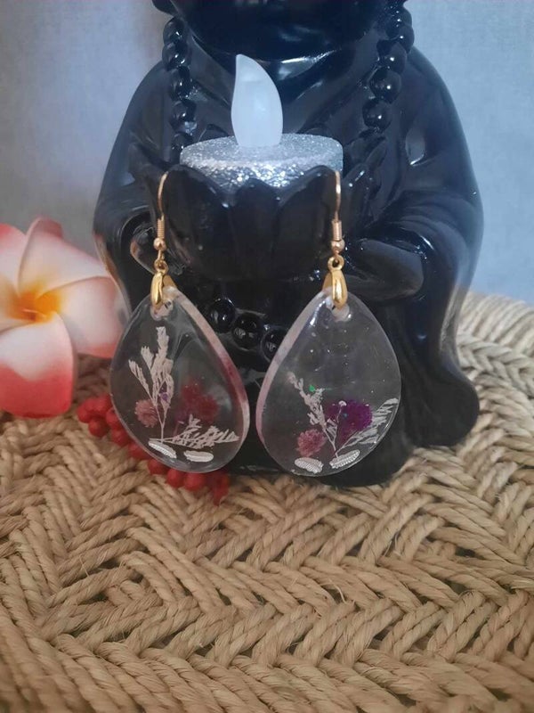 Boucle d'oreilles transparente avec fleurs
