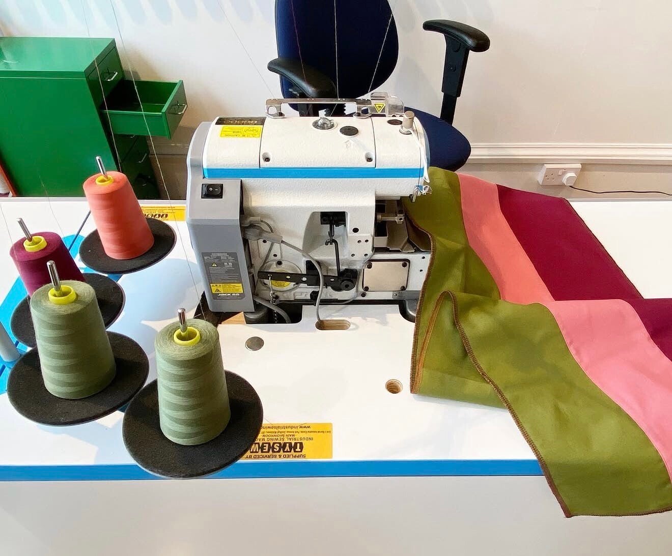 Sewing machine and threads in the Summertown Tailoring workroom, Oxford