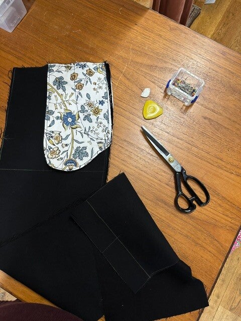 Hem turned and pressed on navy fabric at Summertown Tailoring, Oxford