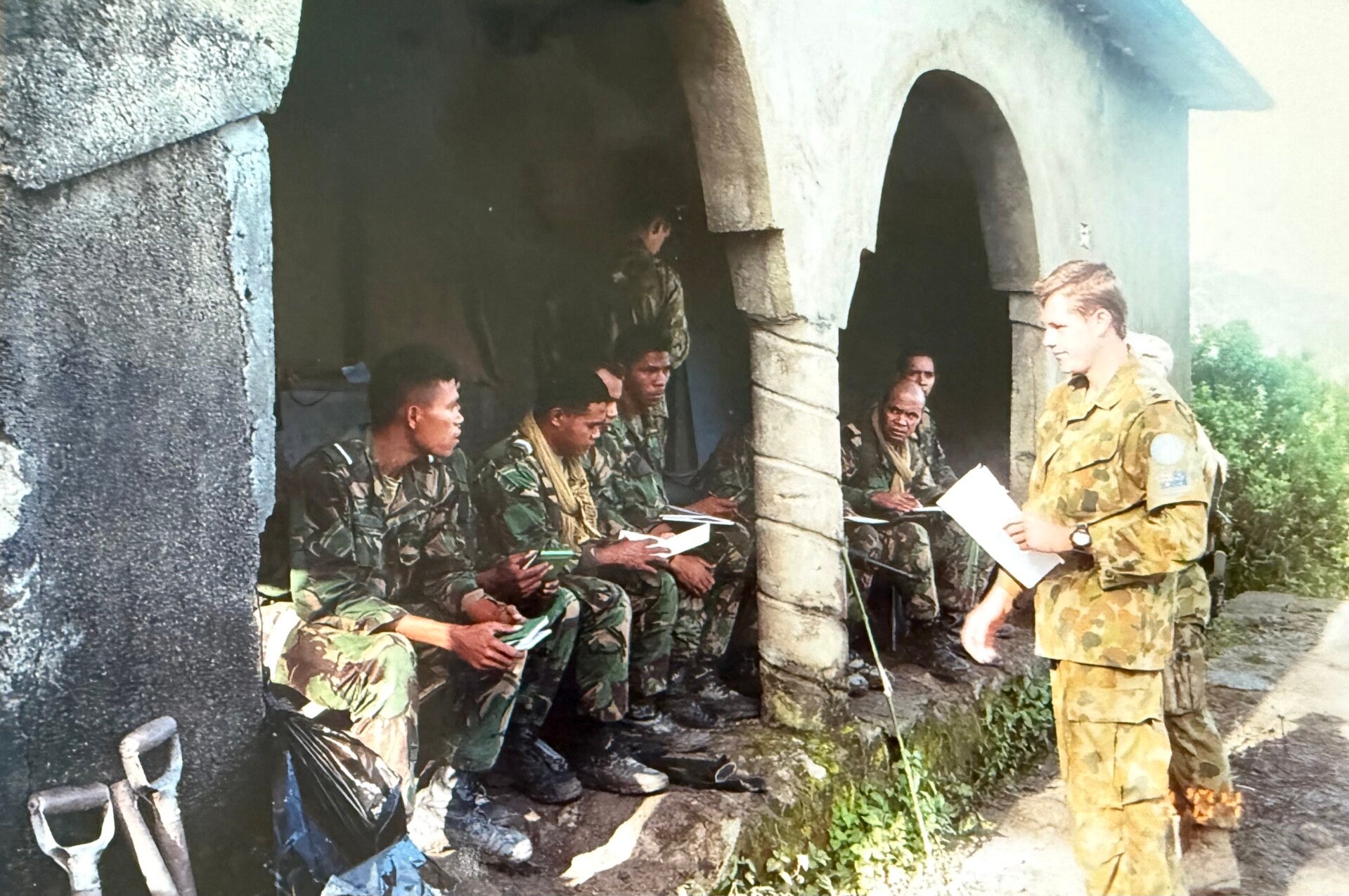Daniel O'Neil instructing local soldiers in East Timor