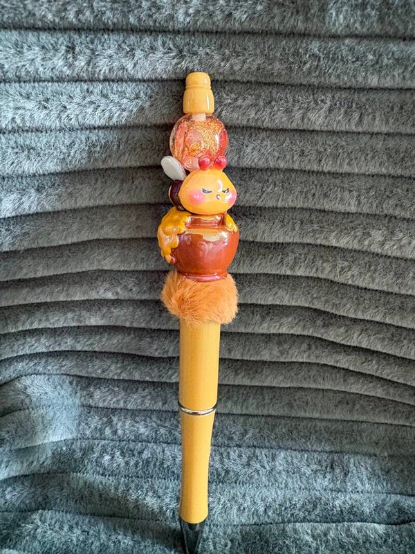 balpen met bij en honing pot