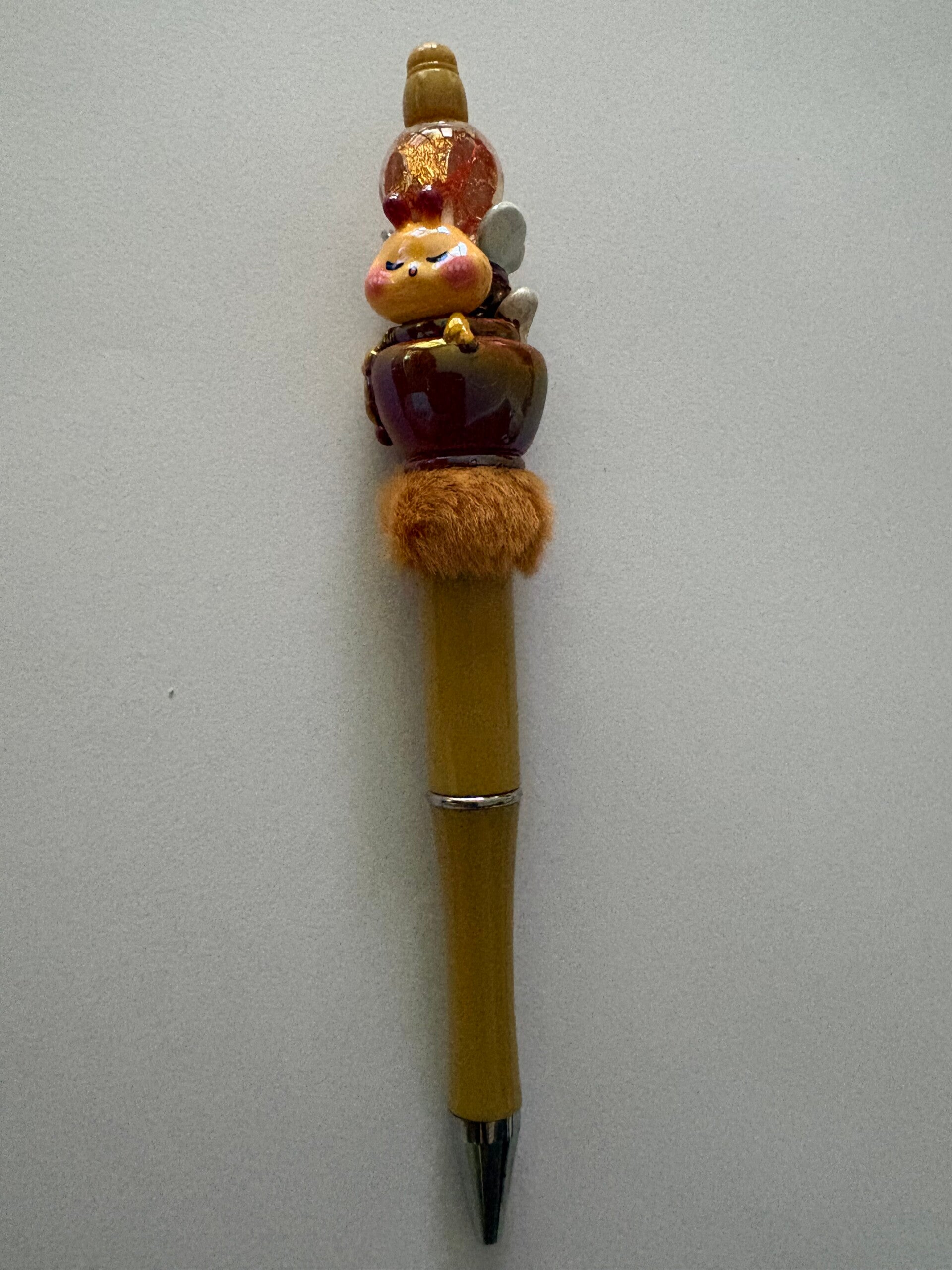 balpen met bij en honing pot