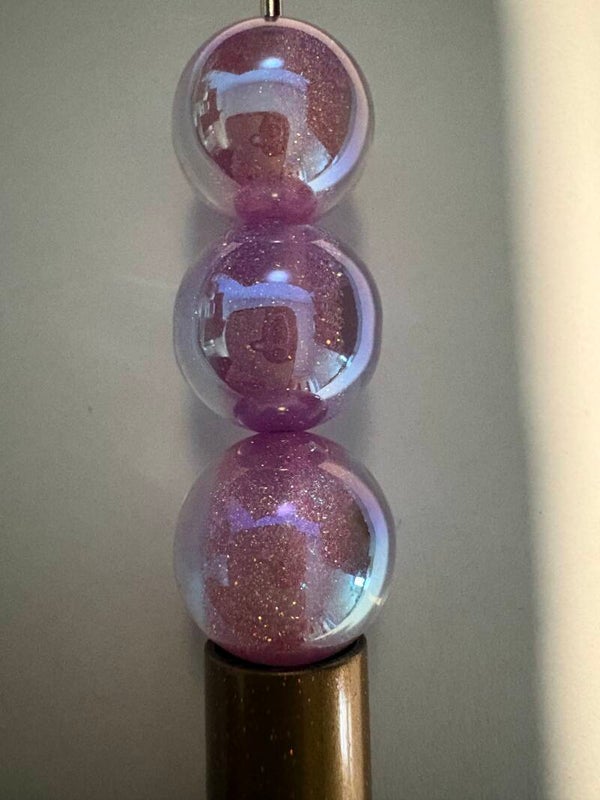 doorzichtige acryl kraal met paarse en gouden glitter 16 mm