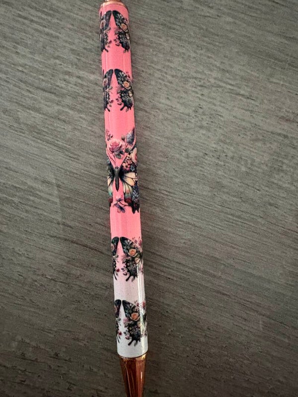 de roze marmer balpen met vlinder